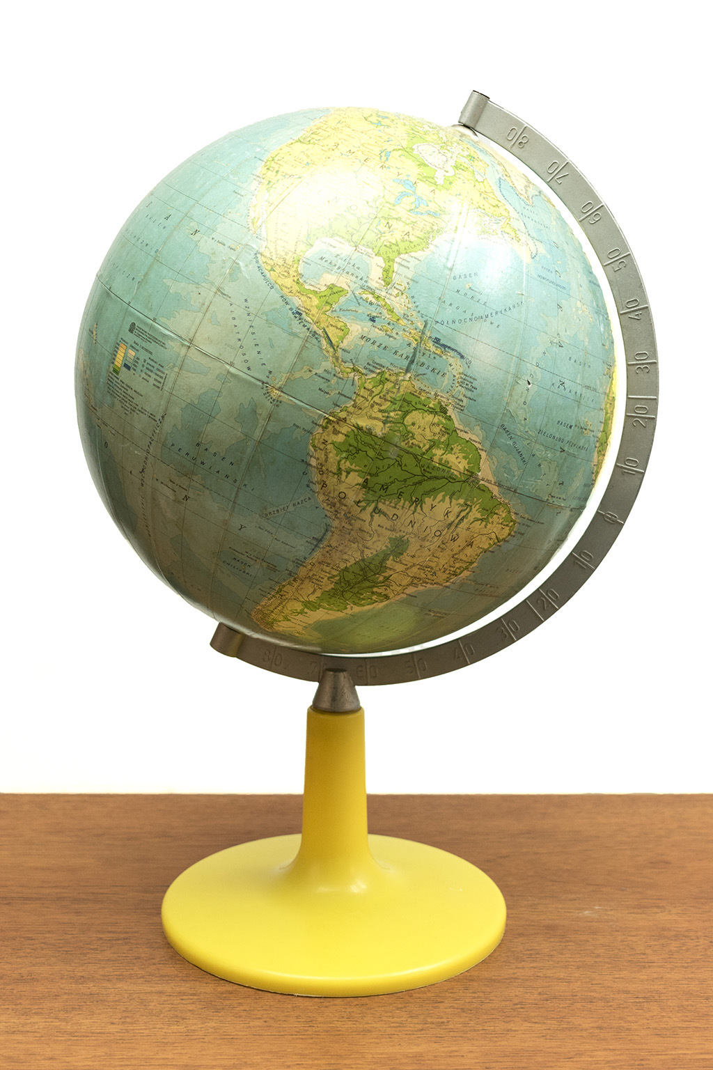 Polish globe with a yellow plastic base