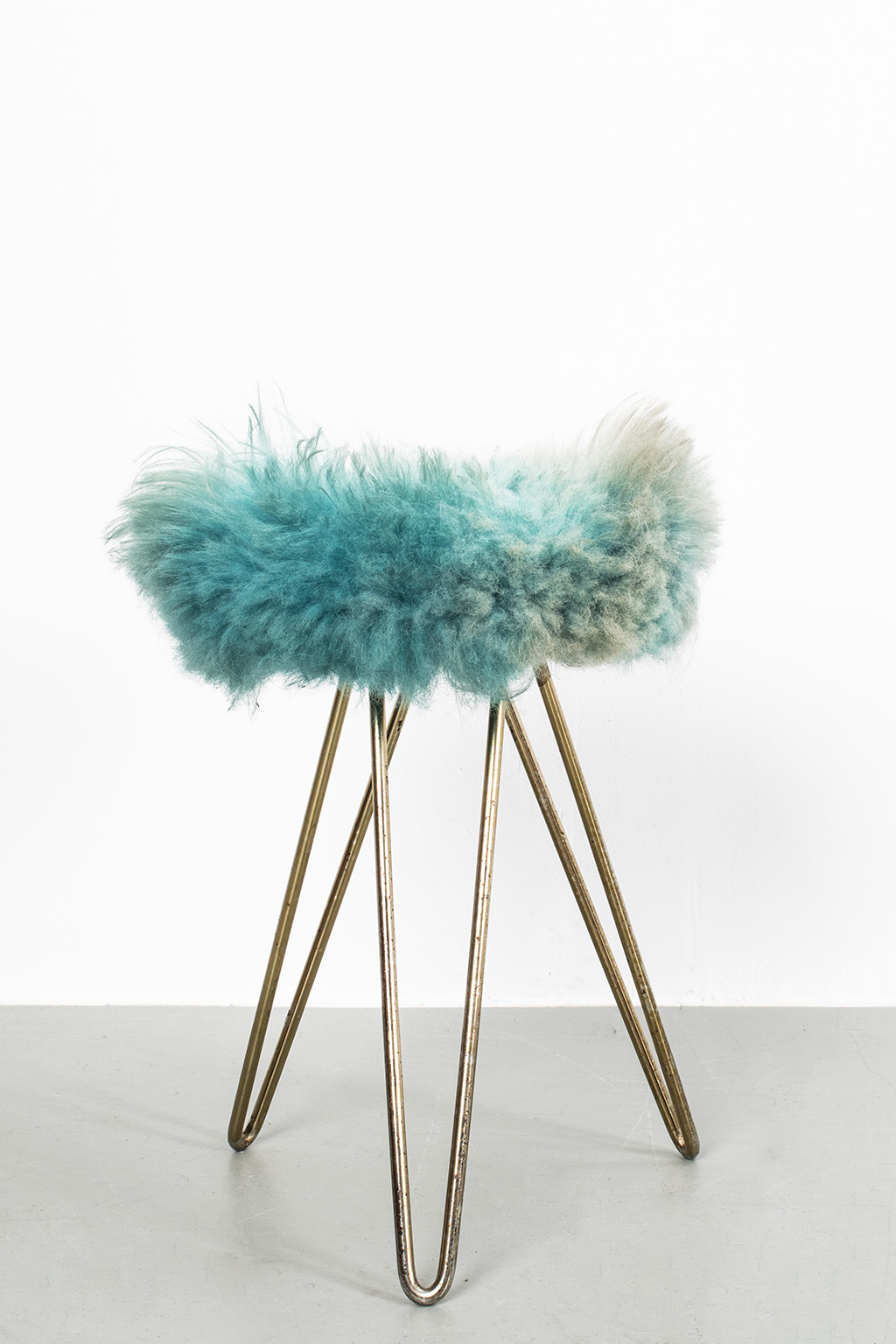 Blue fluffy stool with loop legs