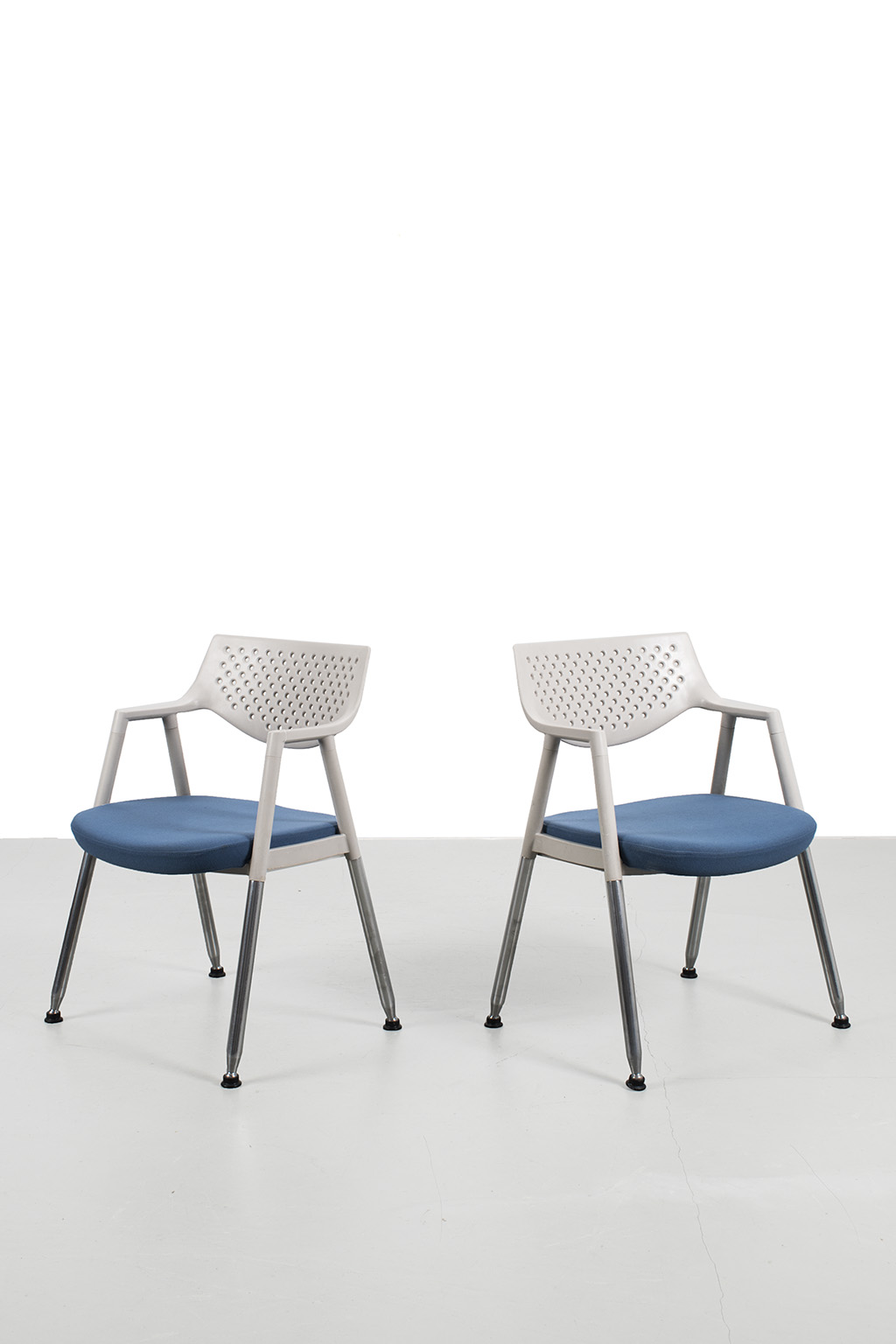 Pair of Vitra chairs with armrests