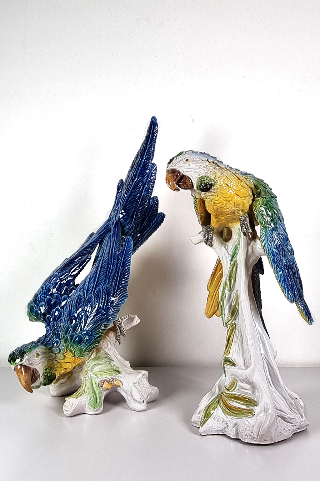 Pair of ceramic macaws